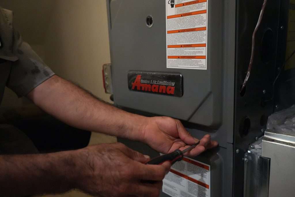 The Werrlein Companies repair person services a heating unit