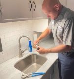 The Werrlein Companies repair person services a kitchen sink