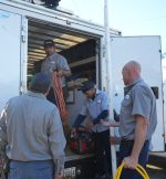 The Werrlein Companies employees grabbing gear out of the back of the company truck