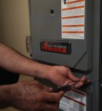 The Werrlein Companies repair person services a heating unit