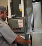 The Werrlein Companies employee services an air handler