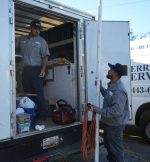 The Werrlein Companies employees grabbing gear out of the back of the company truck