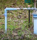 Image of a well pump installed in the ground.