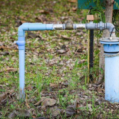 Image of a well pump installed in the ground.